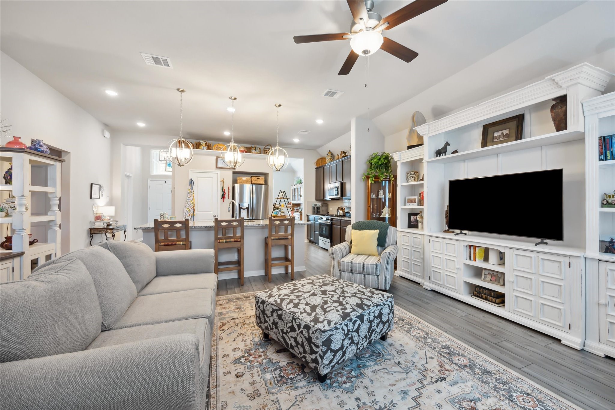 1010 Old Vine Road Brenham, TX 77833 - Photo 7 of 20 a living room with furniture and a flat screen tv