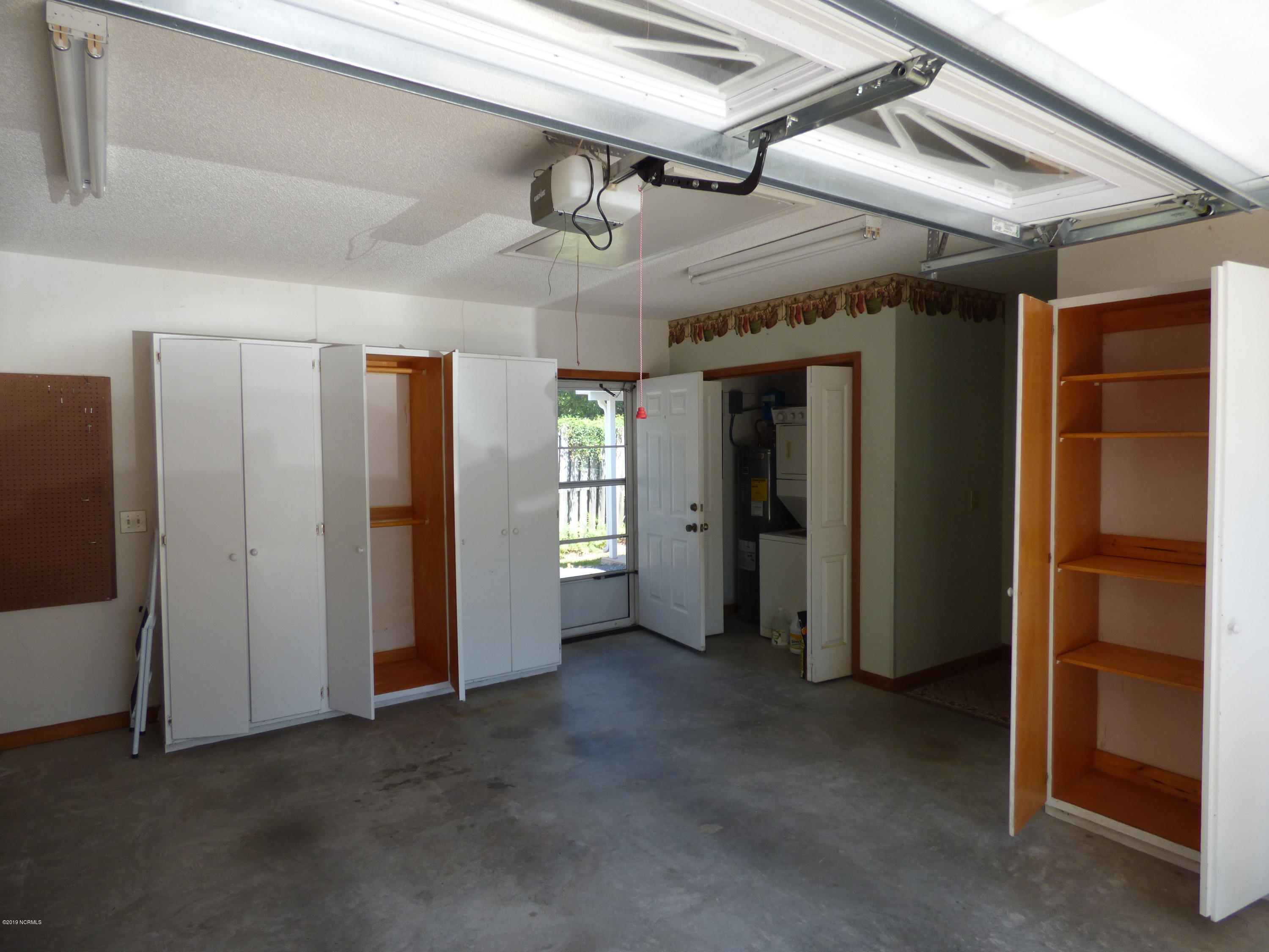 93 Cedar Tree Lane Southwest Calabash, NC 28467 - Photo 35 of 59 Garage with lots of storage!