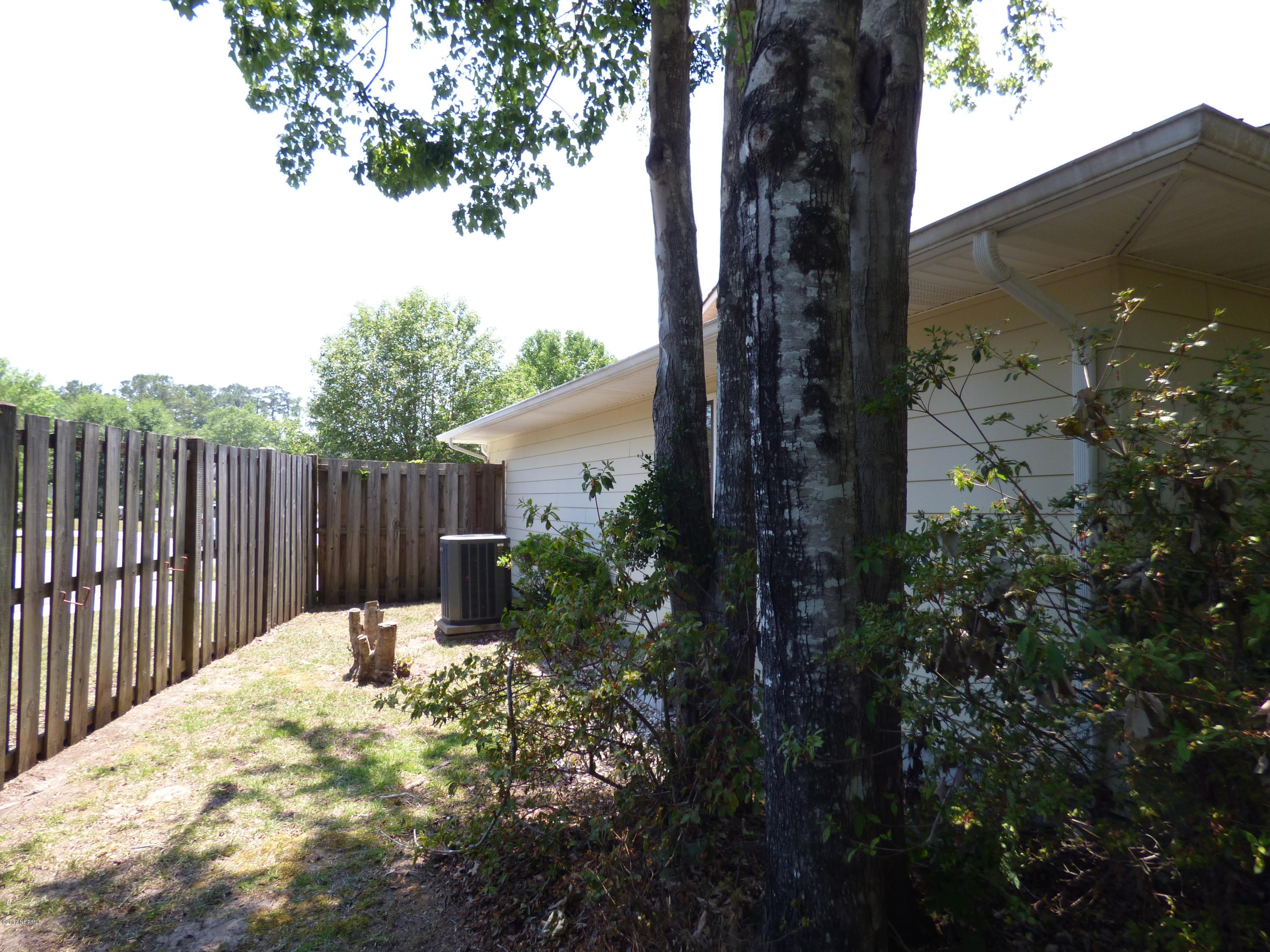 93 Cedar Tree Lane Southwest Calabash, NC 28467 - Photo 41 of 59 side yard