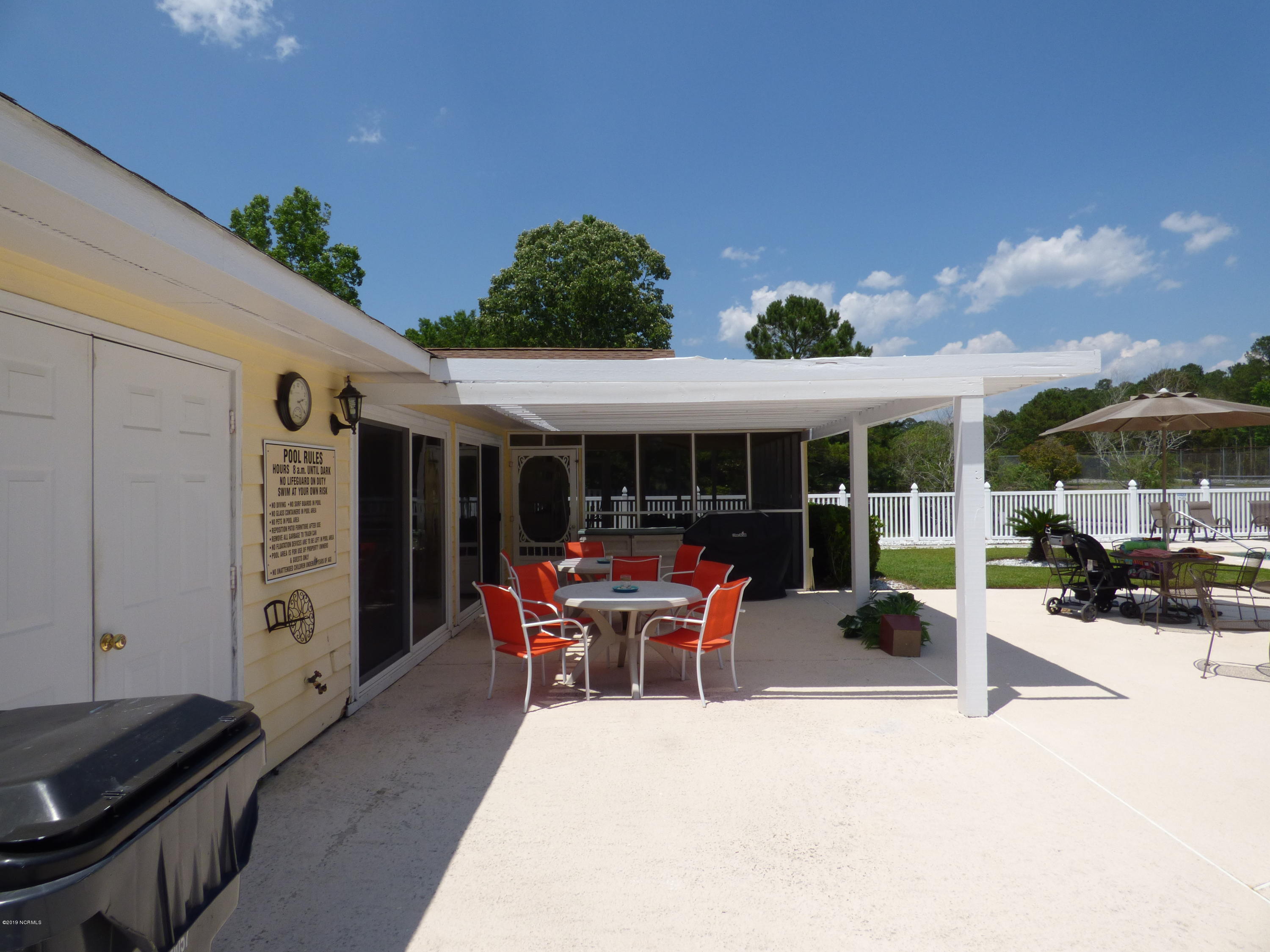 93 Cedar Tree Lane Southwest Calabash, NC 28467 - Photo 51 of 59 Pool patio