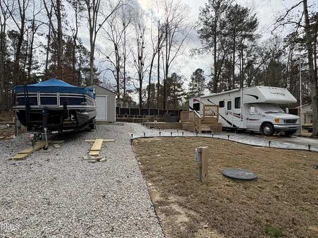 a view of a house with a yard covered with snow in the yard
