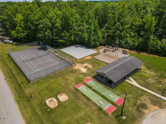 a view of a swimming pool with a yard
