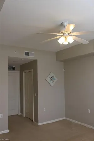a view of a chandelier fan in a room