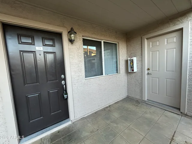 an empty room with a empty space and windows