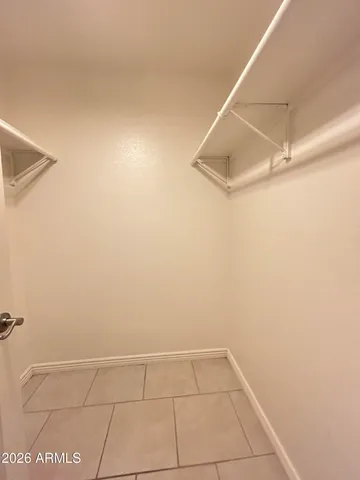 a bathroom with a toilet a sink a mirror a bathtub and shower