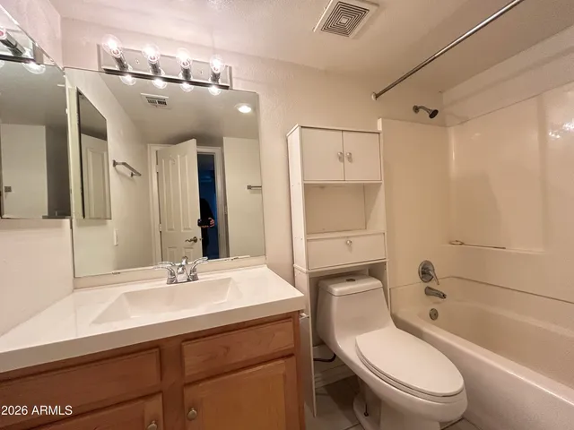 an empty room with a ceiling fan