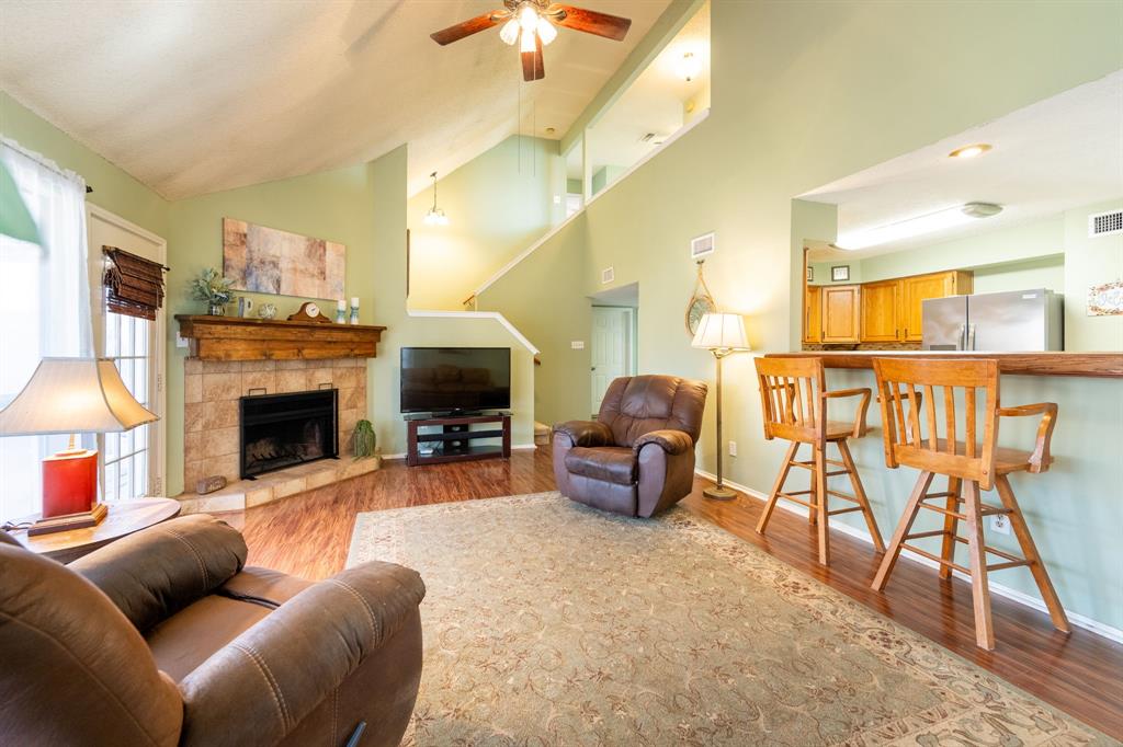 1611 Mission Ridge Trail Carrollton, TX 75007 - Photo 11 of 35 a living room with furniture and a fireplace