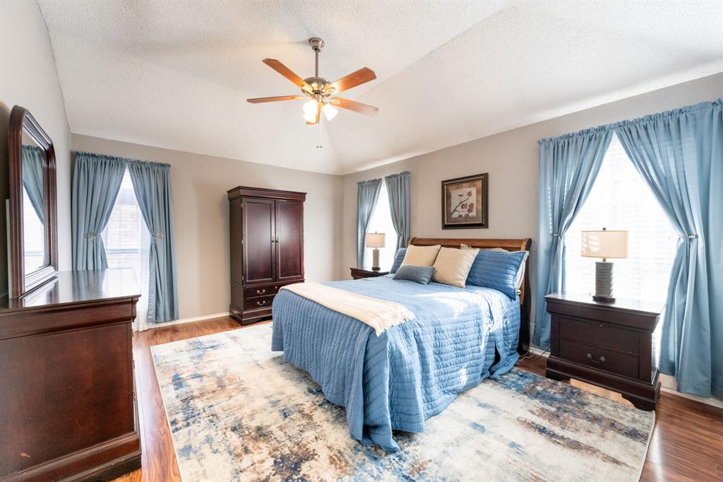 1611 Mission Ridge Trail Carrollton, TX 75007 - Photo 17 of 35 a bedroom with a large bed and a window