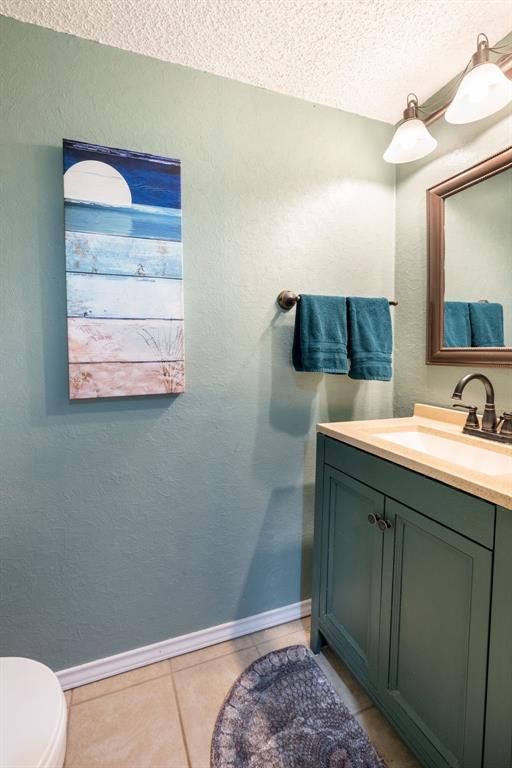 1611 Mission Ridge Trail Carrollton, TX 75007 - Photo 22 of 35 a bathroom with a sink and a mirror