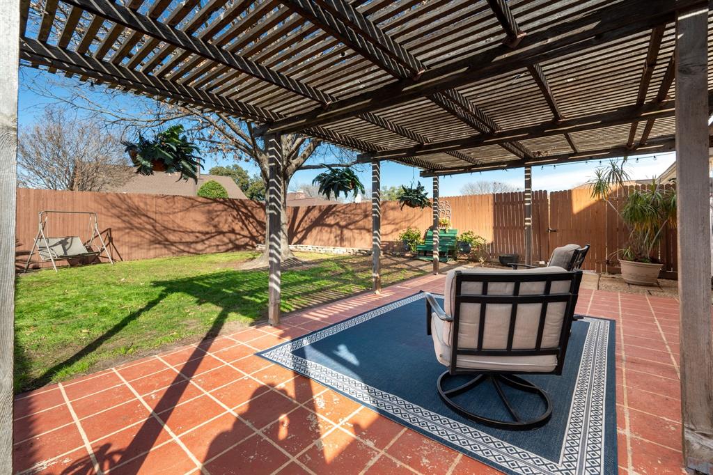 1611 Mission Ridge Trail Carrollton, TX 75007 - Photo 32 of 35 a view of a chairs and table in the patio