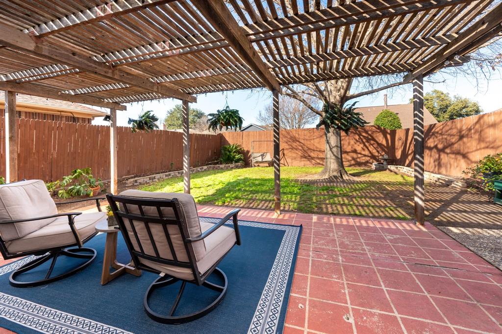 1611 Mission Ridge Trail Carrollton, TX 75007 - Photo 33 of 35 a patio with yard glass top table and chairs