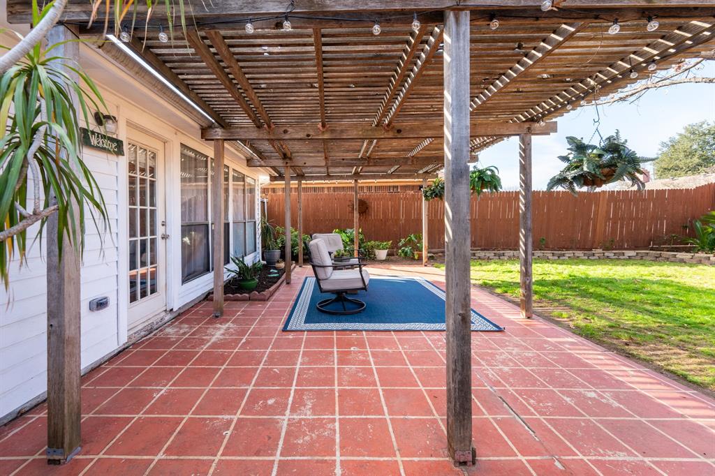 1611 Mission Ridge Trail Carrollton, TX 75007 - Photo 34 of 35 a view of yard from deck with patio