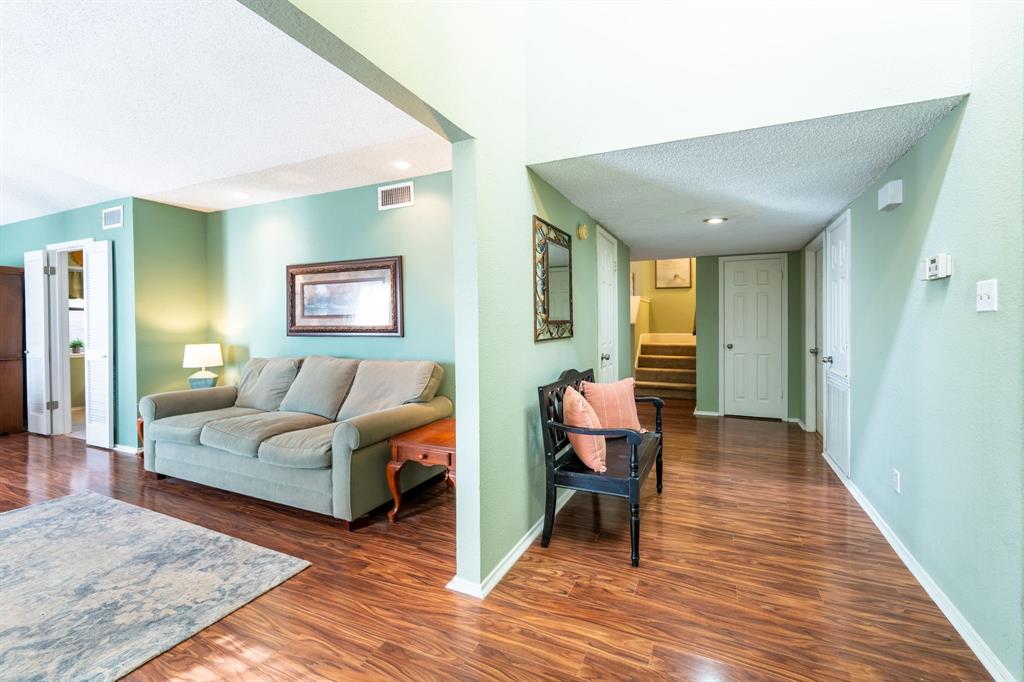 1611 Mission Ridge Trail Carrollton, TX 75007 - Photo 4 of 35 a living room with furniture and a wooden floor