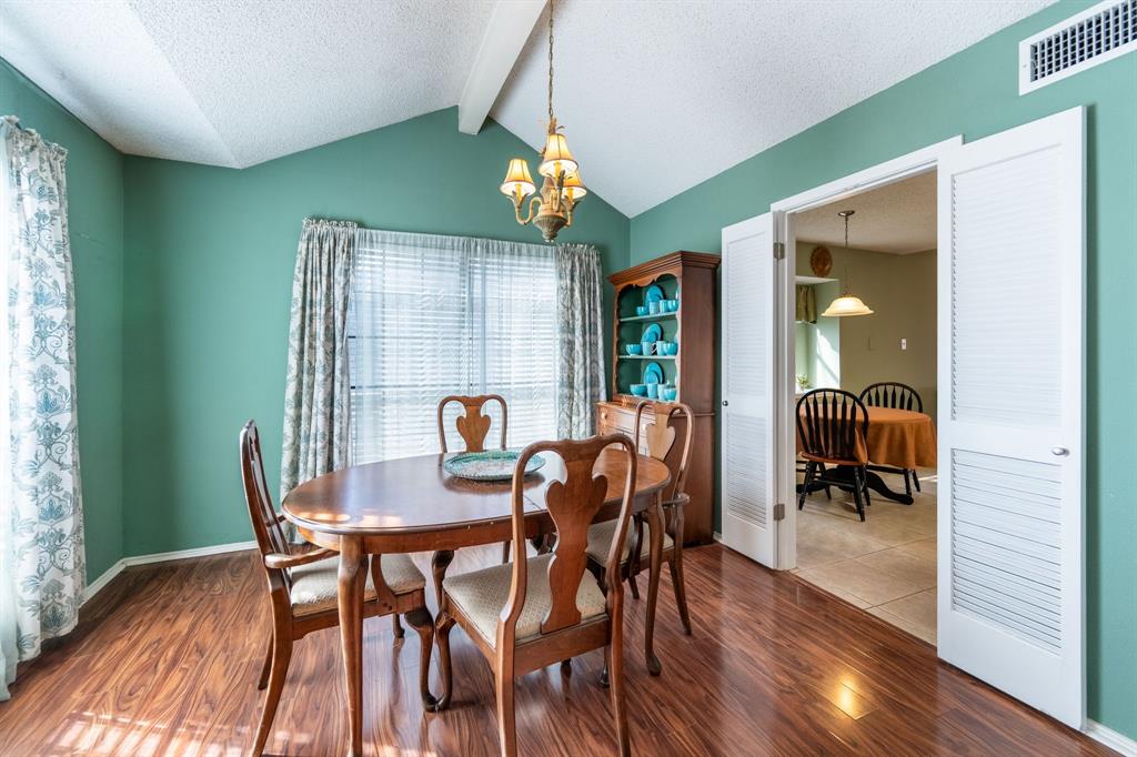 1611 Mission Ridge Trail Carrollton, TX 75007 - Photo 7 of 35 a view of a dining room with furniture window and wooden floor