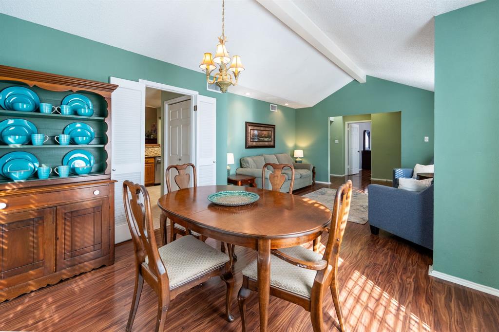 1611 Mission Ridge Trail Carrollton, TX 75007 - Photo 8 of 35 a view of a dining room with furniture and chandelier