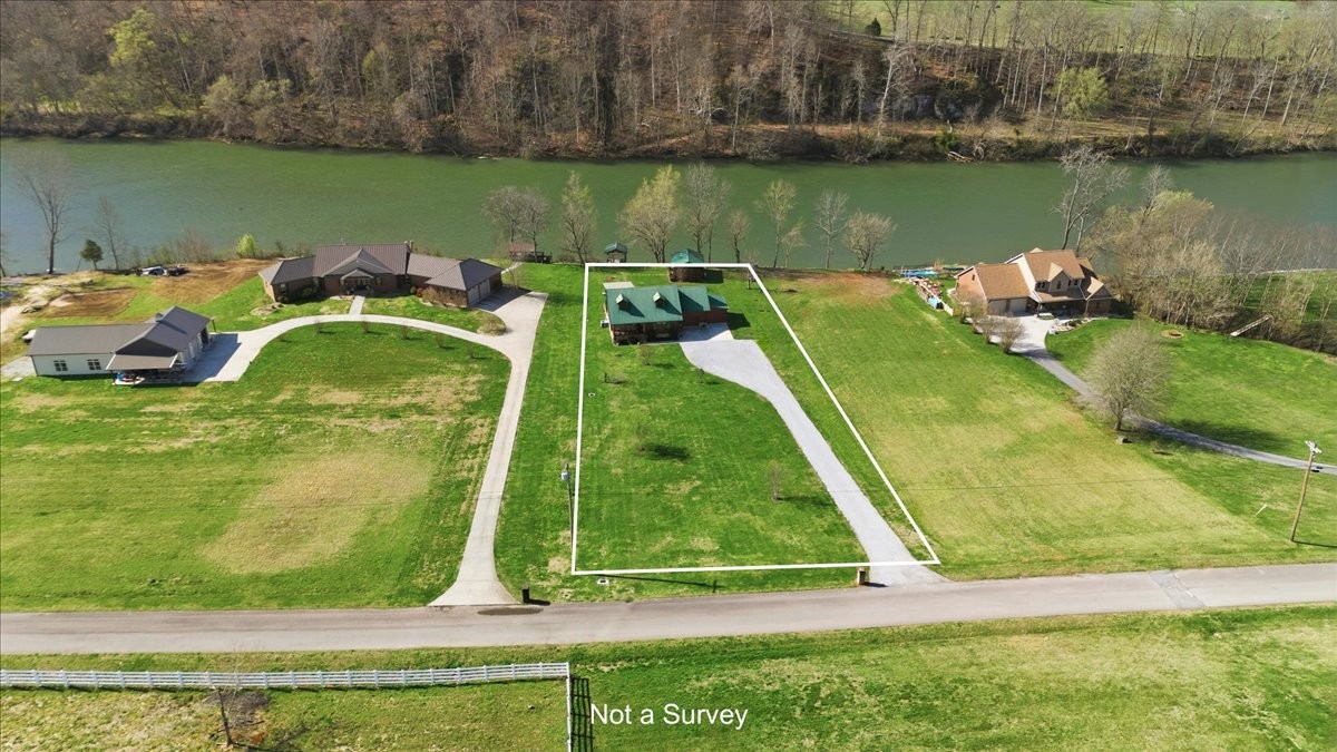854 Holston Shores Drive Rutledge, TN 37861 - Photo 13 of 52 a view of a lake with a house in the background