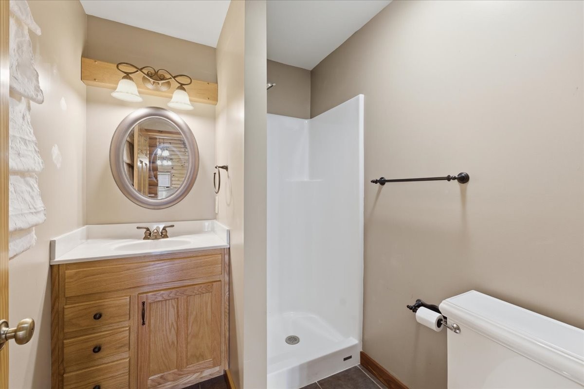 854 Holston Shores Drive Rutledge, TN 37861 - Photo 17 of 52 a bathroom with a sink a toilet and a mirror