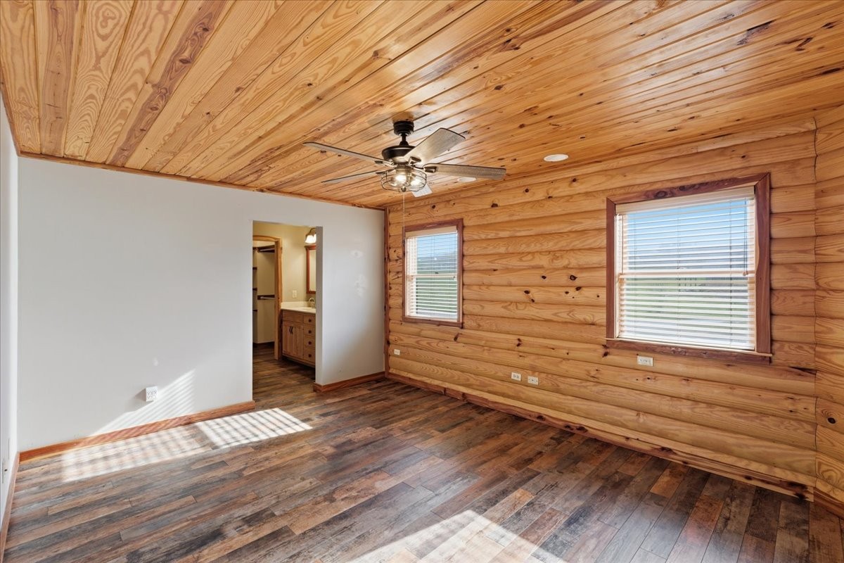 854 Holston Shores Drive Rutledge, TN 37861 - Photo 18 of 52 a view of an empty room with wooden floor and a window