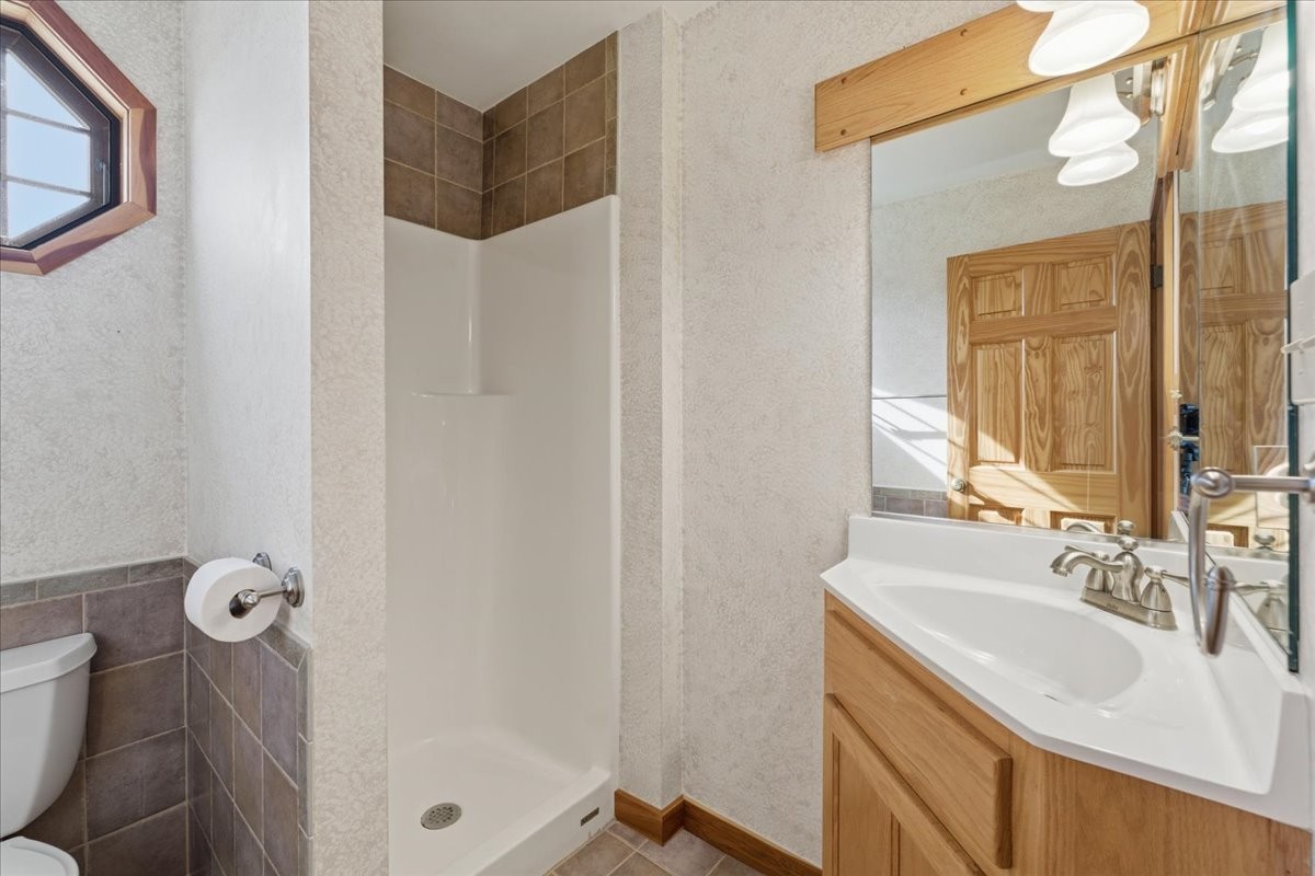 854 Holston Shores Drive Rutledge, TN 37861 - Photo 26 of 52 a bathroom with a sink and mirror with toilet