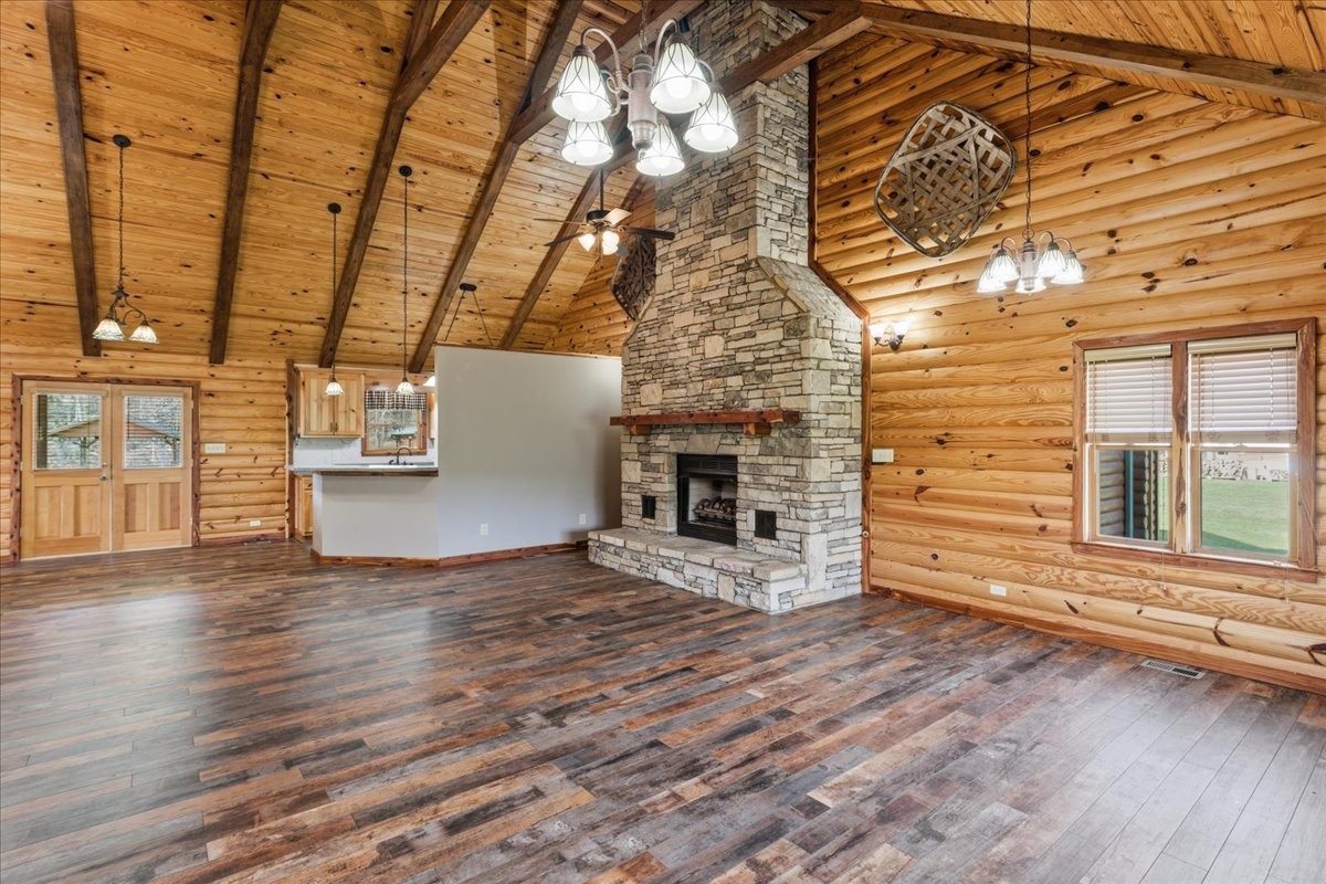 854 Holston Shores Drive Rutledge, TN 37861 - Photo 3 of 52 a view of an empty room with a window and wooden floor