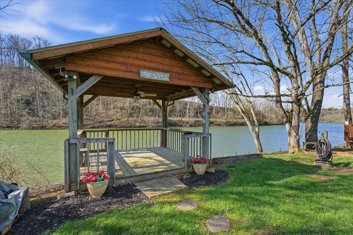 854 Holston Shores Drive Rutledge, TN 37861 - Photo 32 of 52 a view of a backyard with a small cabin