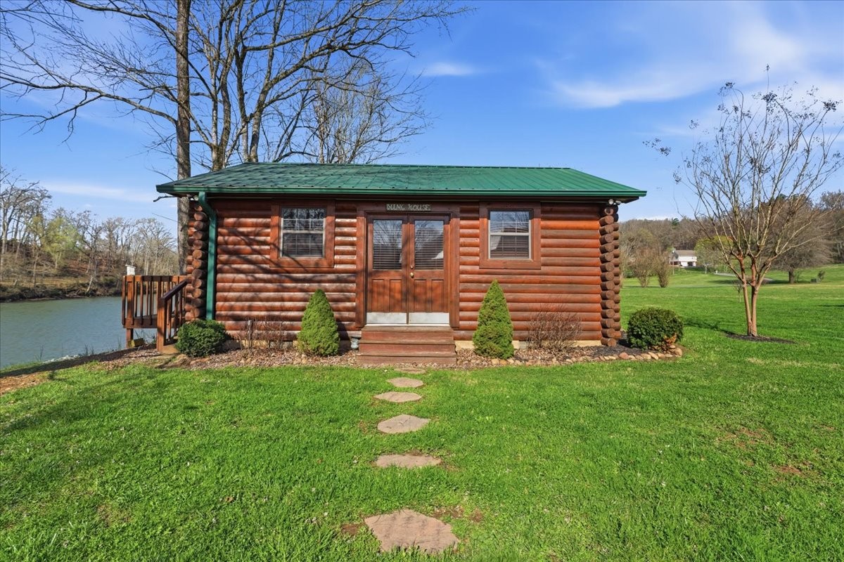 854 Holston Shores Drive Rutledge, TN 37861 - Photo 37 of 52 a front view of a house with a yard