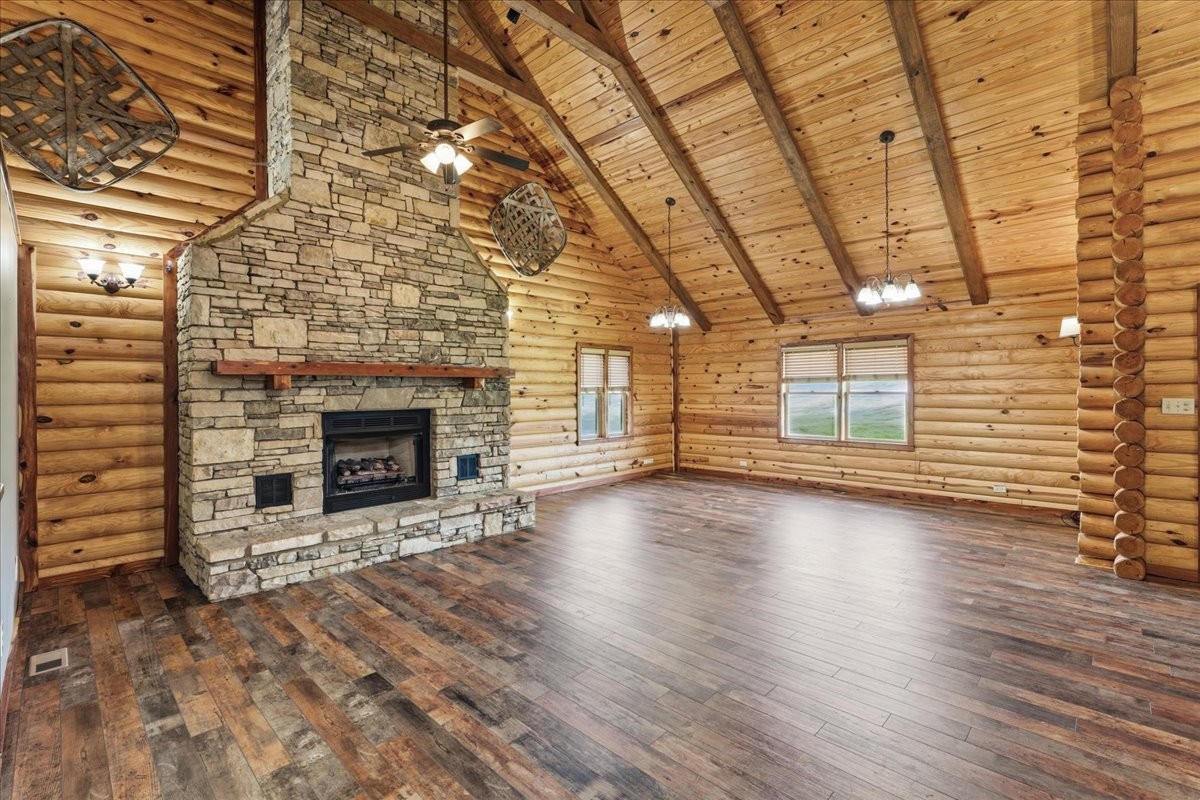 854 Holston Shores Drive Rutledge, TN 37861 - Photo 7 of 52 an empty room with wooden floor and fireplace