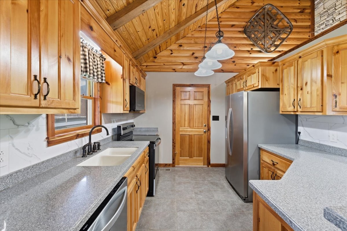 854 Holston Shores Drive Rutledge, TN 37861 - Photo 10 of 52 a kitchen with stainless steel appliances granite countertop a sink a stove and refrigerator