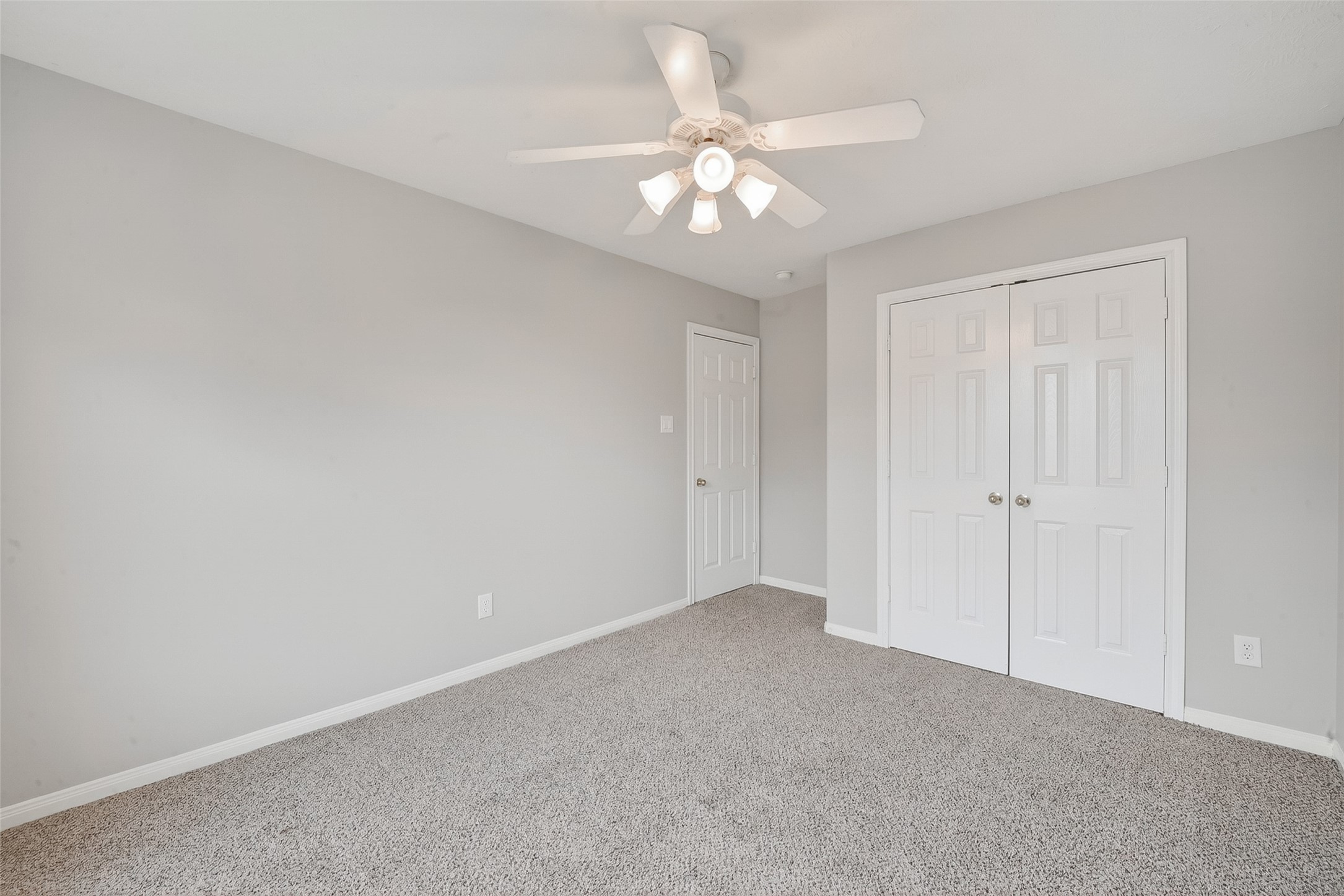 14308 Rocky Briar Lane Rosharon, TX 77583 - Photo 35 of 46 a view of an empty room with a chandelier fan