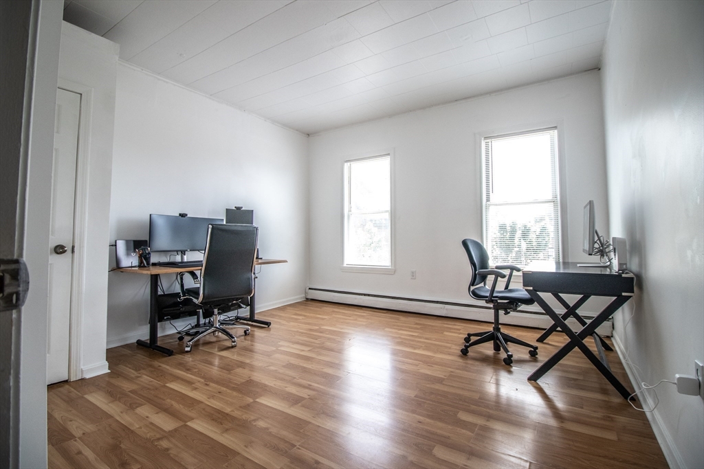 91 Elm Street Holyoke, MA 01040 - Photo 13 of 32 a view of a workspace with furniture and a window