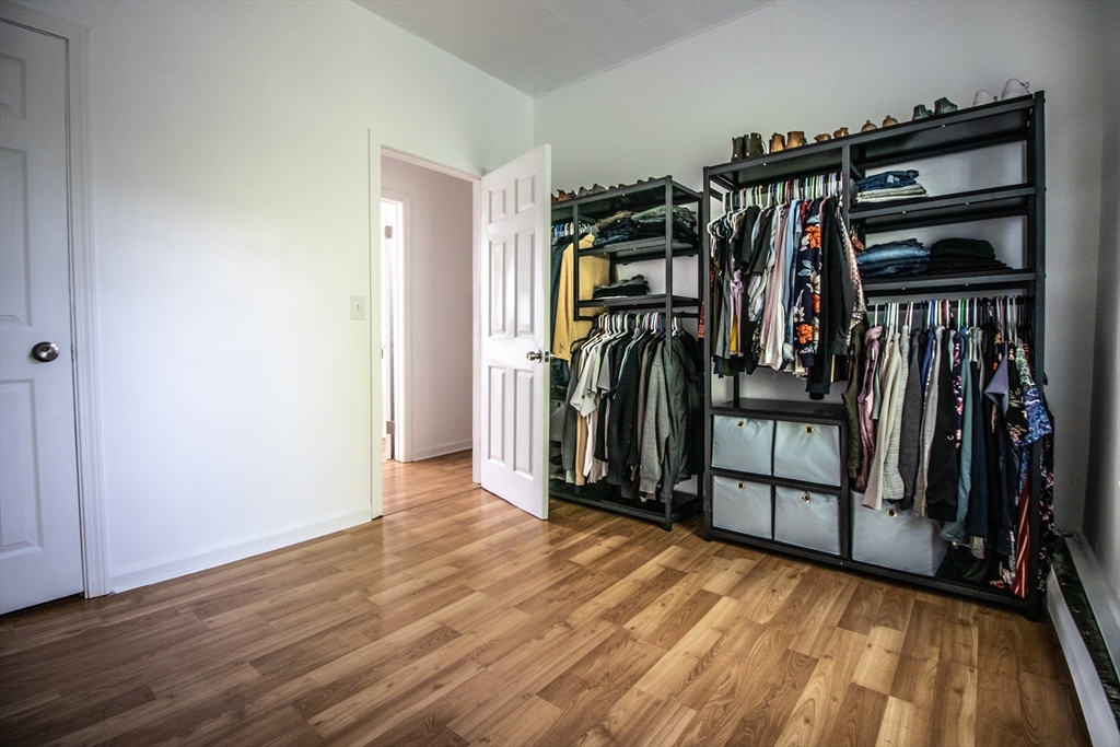 91 Elm Street Holyoke, MA 01040 - Photo 17 of 32 a view of walk in closet with clothes