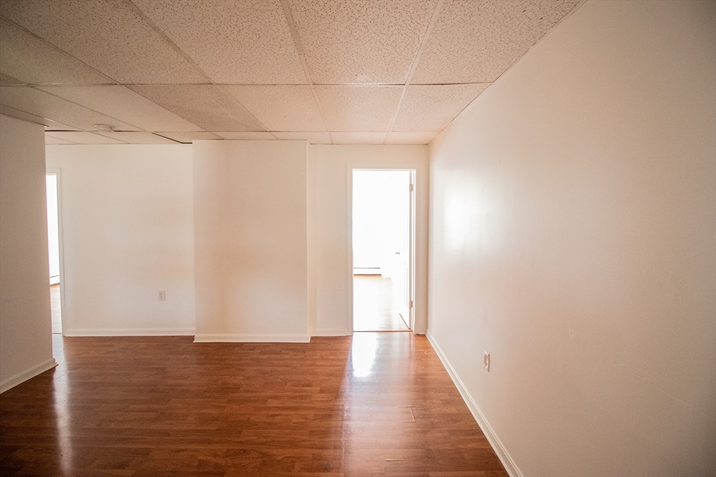 91 Elm Street Holyoke, MA 01040 - Photo 20 of 32 a view of a room with wooden floor