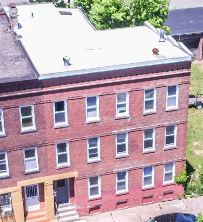 91 Elm Street Holyoke, MA 01040 - Photo 2 of 32 a front view of a building with a lot of windows