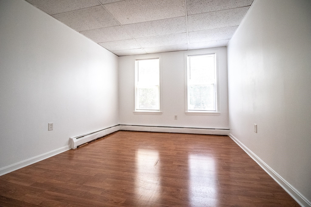 91 Elm Street Holyoke, MA 01040 - Photo 24 of 32 wooden floor in an empty room with a window