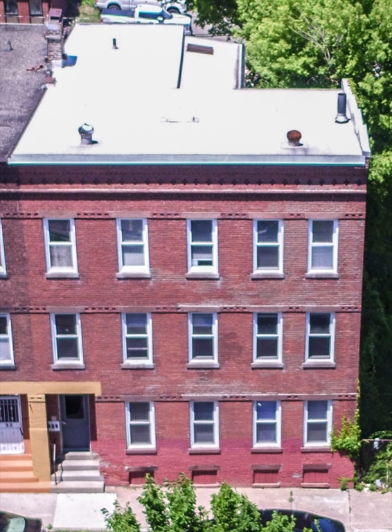 91 Elm Street Holyoke, MA 01040 - Photo 3 of 32 a front view of a building with a yard