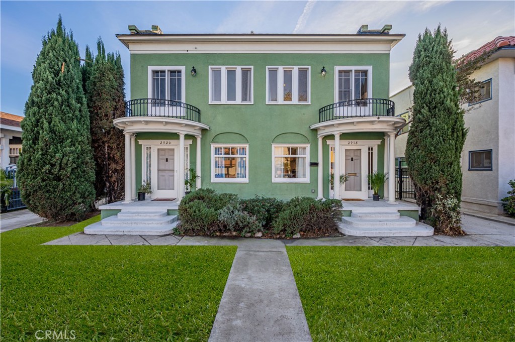 2920 East 7th Street Long Beach, CA 90814 - Photo 1 of 13 a front view of a house with a garden