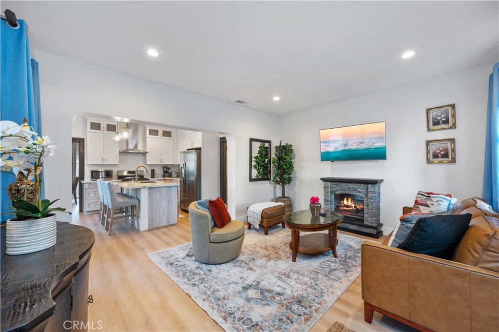 2920 East 7th Street Long Beach, CA 90814 - Photo 3 of 13 a living room with furniture and a fireplace