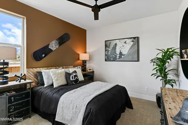 a bedroom with a bed and a potted plant