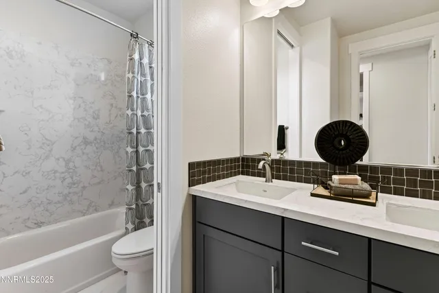 a bedroom with a bed a potted plant and a window
