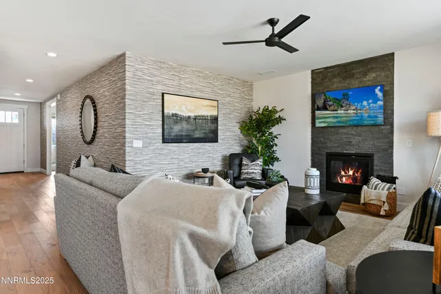 a living room with furniture and a fireplace