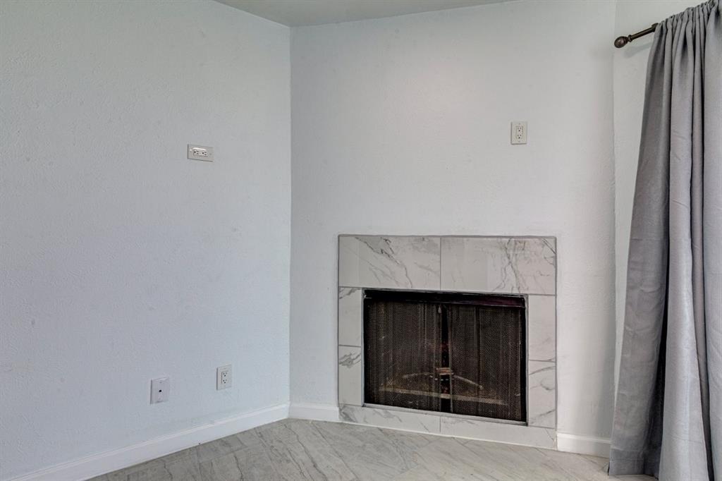 4606 Chaha Road, Unit 106 Garland, TX 75043 - Photo 16 of 22 Interior details featuring a premium fireplace