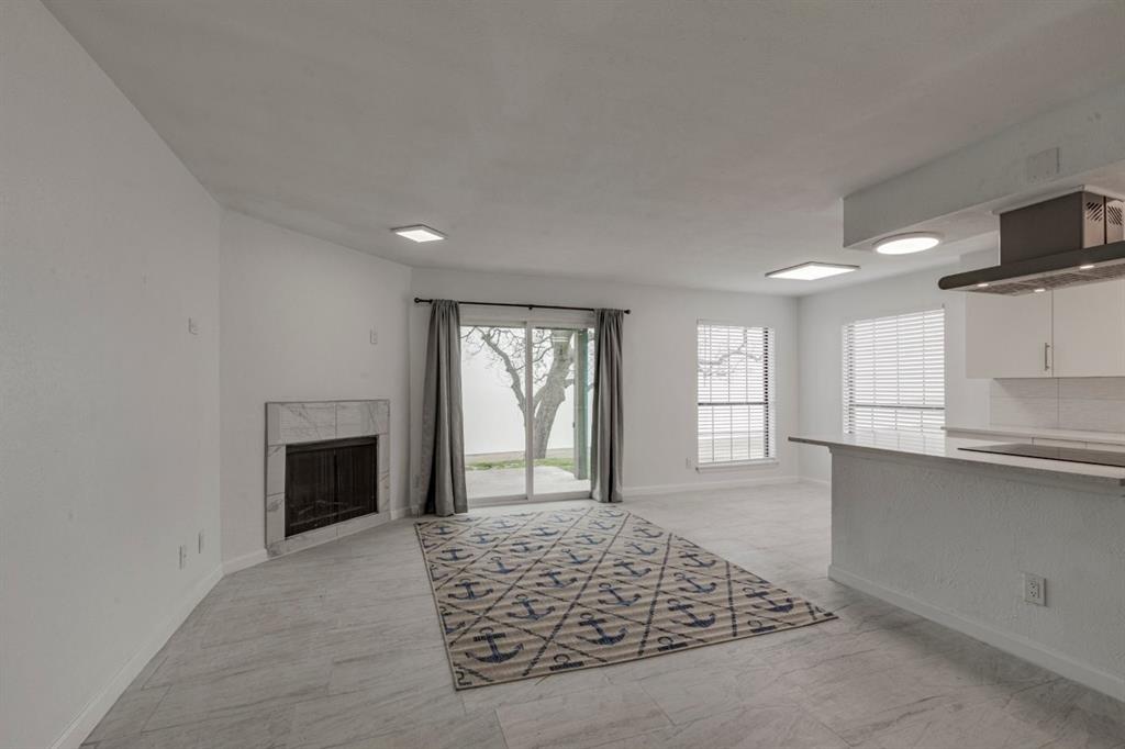 4606 Chaha Road, Unit 106 Garland, TX 75043 - Photo 18 of 22 Living room with a fireplace