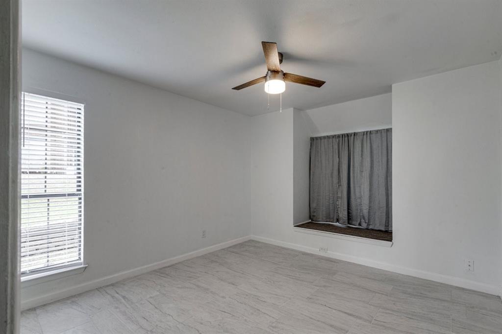4606 Chaha Road, Unit 106 Garland, TX 75043 - Photo 10 of 22 Spare room with ceiling fan