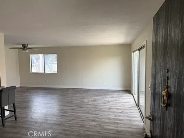 wooden floor in an empty room and a window