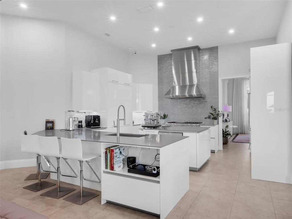 919 Banana Lake Road Lake Mary, FL 32746 - Photo 20 of 76 a large white kitchen with stainless steel appliances granite countertop a sink and cabinets