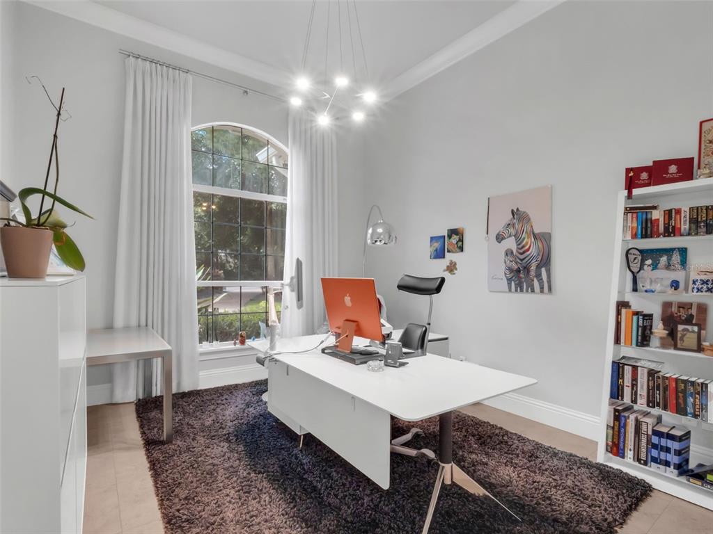 919 Banana Lake Road Lake Mary, FL 32746 - Photo 26 of 76 a living room with furniture and a book shelf