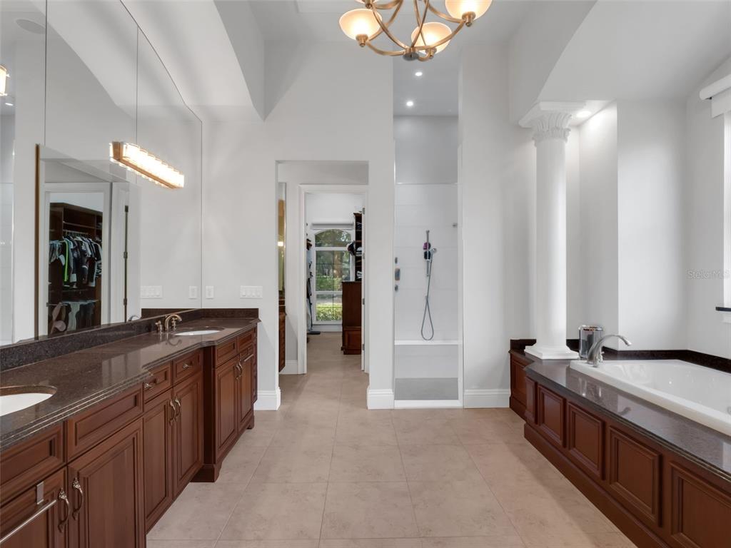 919 Banana Lake Road Lake Mary, FL 32746 - Photo 29 of 76 a large kitchen with a large counter top and stainless steel appliances