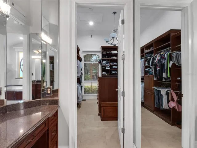 a lobby with furniture and large windows