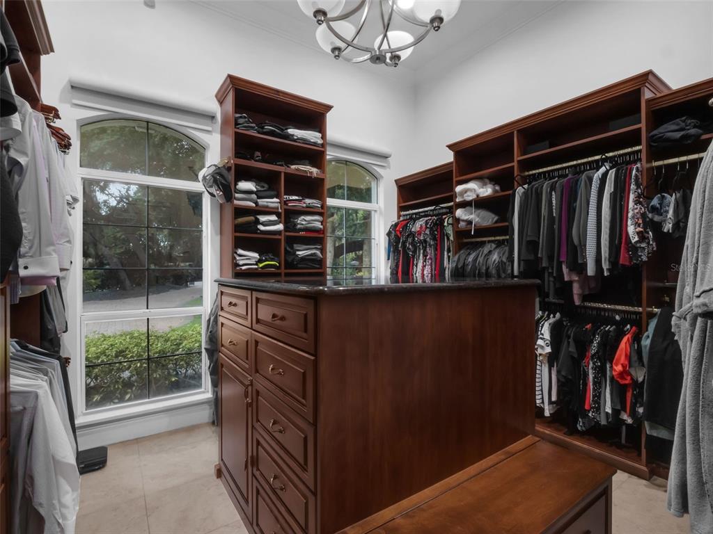 919 Banana Lake Road Lake Mary, FL 32746 - Photo 33 of 76 a view of walk in closet with clothes and shoes