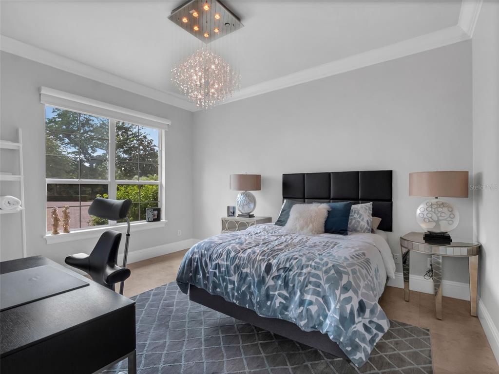 919 Banana Lake Road Lake Mary, FL 32746 - Photo 36 of 76 a bedroom with a bed and a large window